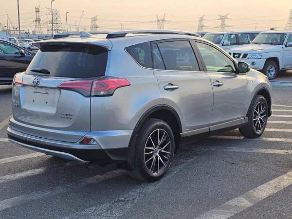 Toyota RAV 4 2017  Silver LHD Hybrid AT SUV Crossover 4WD view 9